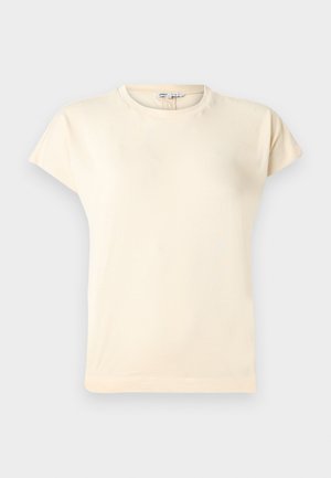 Kreemikas lühikeste varrukatega ümara kaelusega t-särk, veidi vabalt istuv ja minimaalsete õmbluse detailidega.