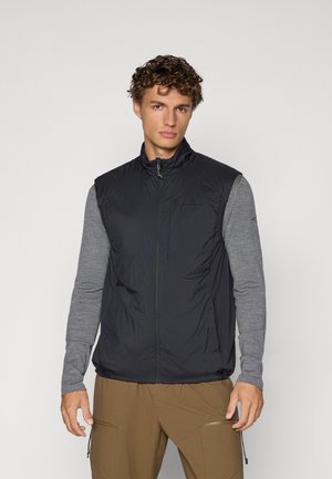Schwarze isolierte Weste mit hohem Kragen und Frontreißverschluss, versehen mit einem leichten, glänzenden Stoff und einem grauen Langarmshirt darunter.