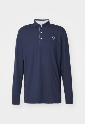 Granatowa koszula polo z długim rękawem, wykonana z miękkiego materiału, z kołnierzykiem, plastronem na trzy guziki i logo na lewej piersi.