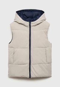 Svetlo bež brezrokavnik s kapuco, ki ima temno mornarsko podlogo in osrednji zadrgo. Vključuje dve stranski žepi.