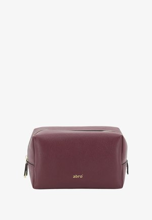 Rectangular maroon leather toiletry bag with gold zipper and small gold "abro" logo on front.