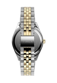 Sølv- og gullfarget rustfritt stål ur med et blandet lenkearmbånd, rund svart skive, gullfargede aksenter og en trykk-og-dra krona.