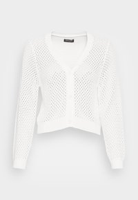 Cardigan blanc en tricot avec un col en V, des manches longues et une fermeture à boutons. Le tissu présente un motif en maille ouverte et des bords côtelés.