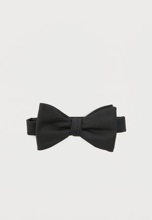 Sort tekstureret stofslips med justerbar strop, lagt fladt på en hvid baggrund.