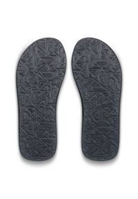 Sorte gummisulds indlæg med en tekstureret design og geometriske mønstre, der giver greb og komfort. Glatte kanter, skåret til at passe.