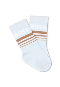Calze di cotone azzurro chiaro con logo bianco "BOSS" e motivo a righe marroni vicino alla parte superiore. Texture morbida e polsini a coste.