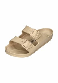 Beige slide sandal made of textured synthetic material, featuring two adjustable straps with rectangular buckles and a contoured footbed.