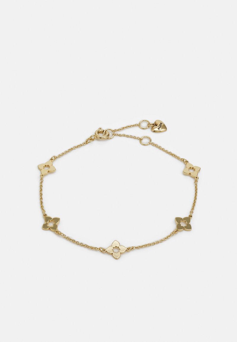 Bracciale d'oro con link a forma di fiore con design a intaglio, una delicata catena e un fermaglio a forma di cuore con dettaglio del marchio.