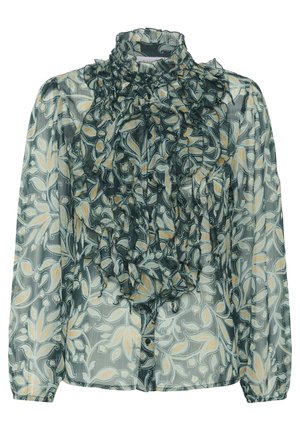 Permatomas ilgomis rankovėmis palaidinė su žaliu ir smėlio spalvos gėlių raštu, aukštu raukšlėtu apykakle ir sluoksniuoto raukinio detalėmis priekyje.