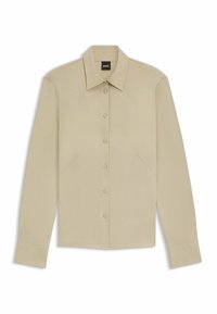 Beige langärmliges Hemd mit Knopfleiste, das einen scharfen Kragen, Schulternähte und einen abgerundeten Saum aufweist. Glattes Material mit dezentem Glanz und taillierter Passform.