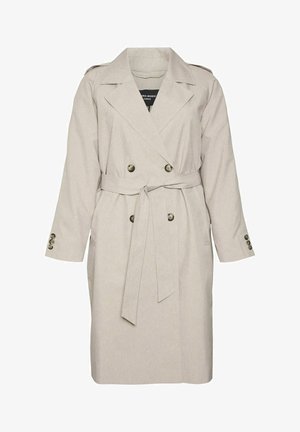 Beige takki, jossa on kaksiriviset napit, vyötärölle sidottu vyö ja hartiatoppaukset. Omaaa pitkät hihat ja sivutaskut. Kankaan rakenne on teksturoitu.