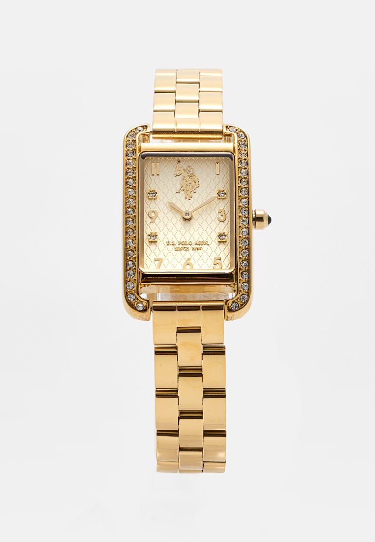 Goldfarbene rechteckige Uhr mit Kristallakzenten, strukturiertem Zifferblatt und goldfarbener Metallarmband. Verfügt über ein Logo und Stundenmarker für bessere Lesbarkeit.