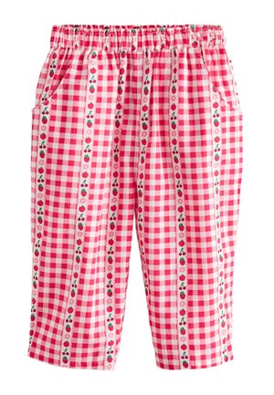 Lyserøde og hvide ternede shorts med elastisk linning og lodrette mønstre af frugt og blomster, herunder jordbær og kirsebær.