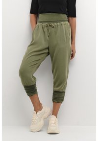 Cream Tygbyxor - green