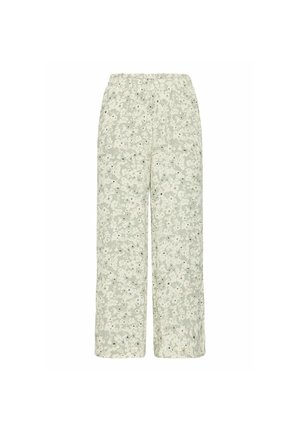 Helle grüne weit geschnittene Hosen mit Floral-Druck und elastischem Bund. Der Stoff hat eine weiche Textur und zeigt kleine Schwarz-Weiß-Blumenmuster.