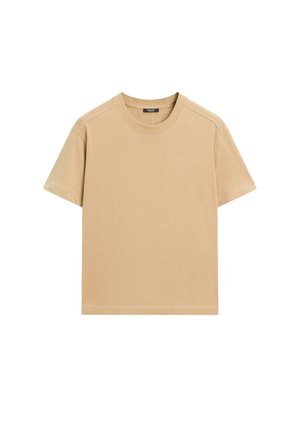 T-shirt en coton beige à manches courtes, col rond et coupe décontractée. Présente une texture lisse et des coutures soignées sans motifs.