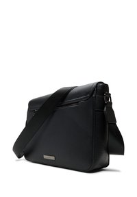 Black leather messenger bag with a textured finish. Features a zippered pocket, adjustable strap, and a metallic brand plaque on the front.