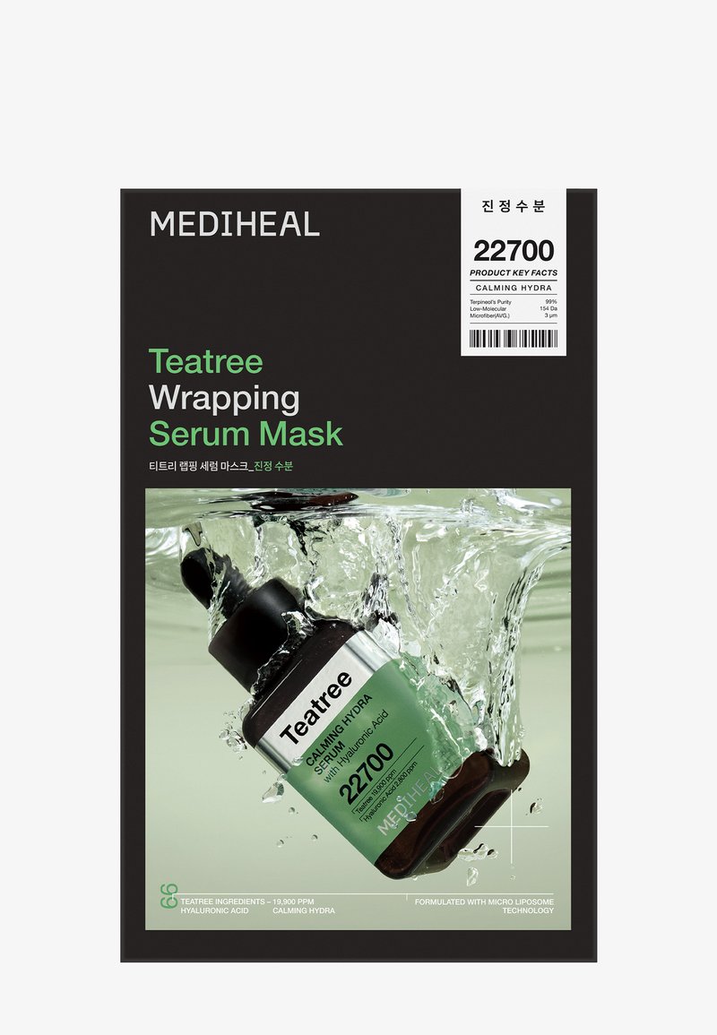 Emballage du masque Mediheal Teatree Wrapping Serum Mask montrant un flacon de sérum immergé dans l'eau avec des détails apaisants hydra et acide hyaluronique.