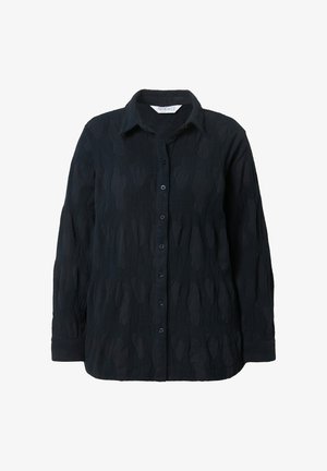 Sort skjorte med et tekstureret mønster, der har knaplukning foran, lange ærmer og klassisk krave. Let løs pasform.