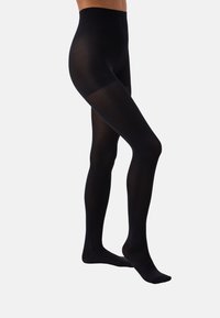 Collants opaques noirs avec une finition mate, un design sans couture et une taille haute. Texture douce, conçue pour le confort et la polyvalence.