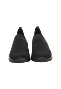 Pair of black slip-on knit sneakers with pull tabs at heels, rounded toes, and rubber soles on white background.