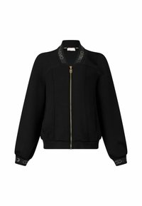 Veste zippée noire au design cintré, avec des poignets et un col côtelés, présentant une bande de logo contrastante. Le matériau semble lisse et doux.