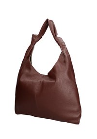 Sac à main en cuir marron texturé avec une forme douce et décontractée, doté de poignées torsadées, sur un fond blanc.