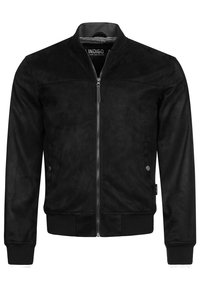 Zwarte bomberjack van zacht suede met een ritssluiting aan de voorkant, ribgebreide manchetten en zoom. Kenmerkend door zijn minimalistische ontwerp en gevoerde binnenkant.