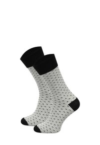 Szare i czarne skarpetki wzorzyste, z czarnym mankietem i palcem u stopy. Materiał wydaje się miękki, o drobnym splocie i małym powtarzającym się wzorze.