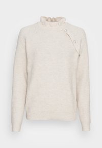 Pull en tricot crème avec un col volanté, des manches longues et une fermeture à boutons sur le côté ornée de embellissements décoratifs.