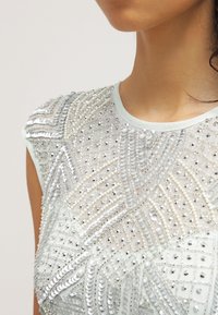Lace & Beads Pouzdrové šaty - mint