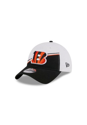 Black and white cap with an orange embroidered "B" logo, and a curved visor. Features a textured fabric and a sticker on the brim.