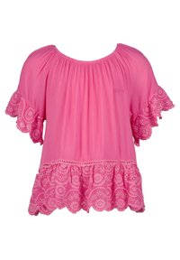 Blusa rosa brillante con vestibilità ampia, scollatura rotonda e bordi in pizzo decorati con ricami floreali sulle maniche e l'orlo.