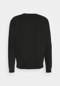 Felpa nera con maniche lunghe, scollo tondo e polsini a coste. Realizzata in tessuto liscio, presenta un design posteriore senza decorazioni.