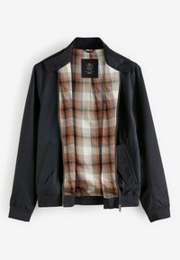Veste noire zippée avec doublure à carreaux marron et crème, deux poches avant à rabat et un col montant.
