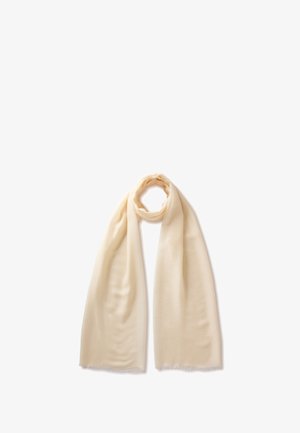 Sciarpa di tessuto morbido beige chiaro, avvolta in modo sciolto con entrambe le estremità che pendono verso il basso su uno sfondo bianco.