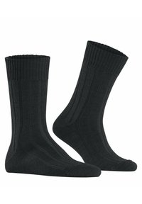 Czarne skarpety prążkowane z fakturowaną powierzchnią, wzmocnioną piętą i palcami oraz długością do połowy łydki z miękkim, elastycznym ściągaczem.
