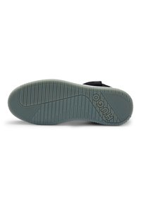 Rubber shoe sole with a textured pattern, featuring grooves in a light gray color and a raised logo element indicating brand identity.