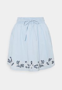 Ljusblå bomullskjol med elastisk midja och dragsko. Utrustad med broderade blommönster i marinblått och krämfärgad vid kanten.