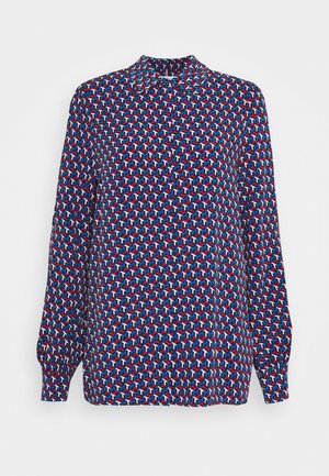 Langarmshirt met een geometrisch patroon in rood, blauw en wit. Gemaakt van lichte stof, met een kraag en elastische manchetten.