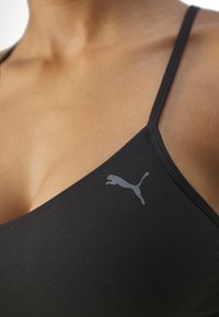 Puma MOVE YOGINI - Sportski grudnjak s blagom potporom - black