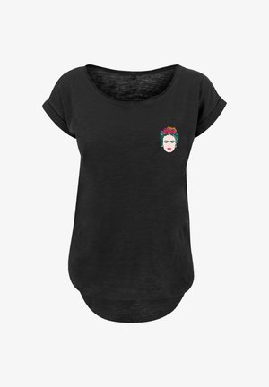 Black short-sleeve shirt with rolled cuffs and a small colorful female face with floral headband printed on the upper left chest.
