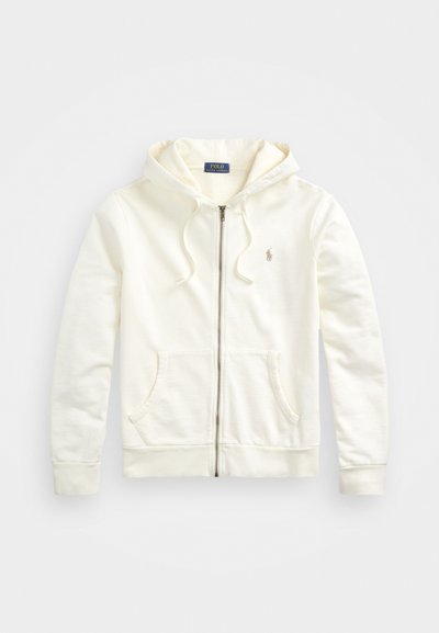 Hvid zip-up hoodie med snoretræk i hætten, frontlommer, ribbede manchetter og et lille broderet logo på venstre side. Blødt bomuldsstof.