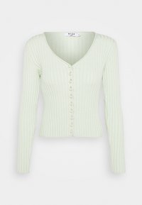 Ribbad långärmad cardigan i ljusgrön, med en djup V-hals och pärlliknande knappar längs framsidan. Inga ytterligare detaljer.