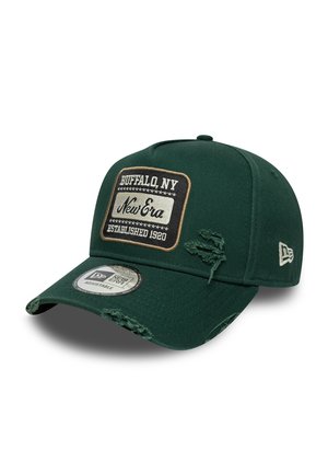 Green baseball cap made of fabric, featuring a rectangular patch with "Buffalo, NY" and "New Era" text, distressed edges, and adjustable back.