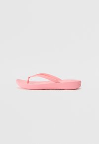 Roza japonka, narejena iz gume. Ima tanek prstni trak in pasove, oblikovano podplat ter teksturirano podlago za oprijem. Lahka zasnova.