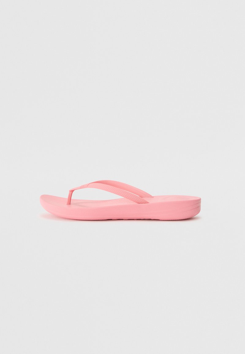Rozā flip-flops, izgatavotas no gumijas. Aprīkotas ar plānu pirkstu siksniņu un siksnām, kontūrveida zoli un struktūrizētu zolīti labākai pielipšanai. Viegls dizains.