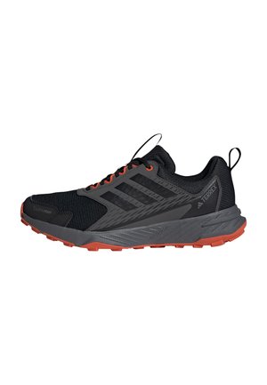 Black and gray Adidas Terrex trail running shoe with orange sole and lace eyelets, featuring Climaproof and Lightmotion technology.