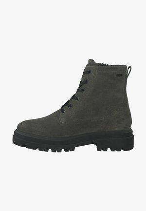 Bottines en damier vert foncé avec une finition texturée, un design à lacets et une semelle en caoutchouc noire épaisse, comportant 5 œillets et une boucle de traction.