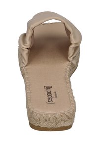 Beige espadrille with a soft, padded upper and a jute-wrapped sole. Features a wide strap and a flat heel, designed for casual wear.